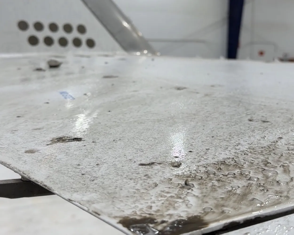 The panel before the visit, carrying exhaust film and grime